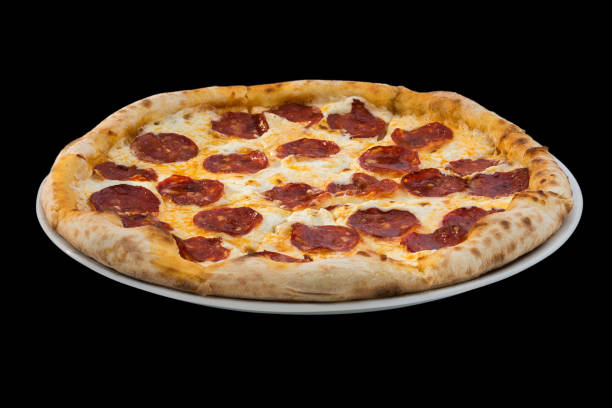 istock pizza with salami and cheese on black background 948475396