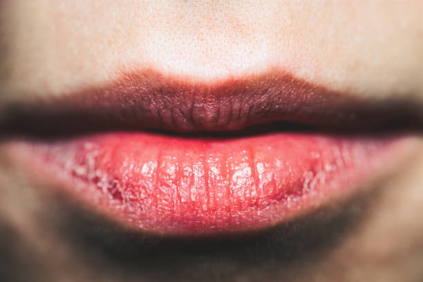 Close-Up Of Sensual Red Lips With Desire stock photo