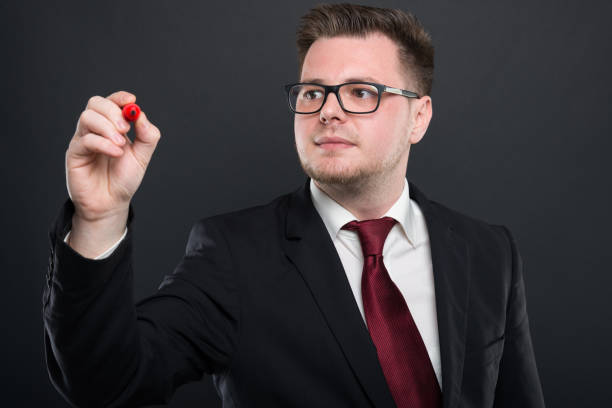istock Business young man writing with red marker 948481434