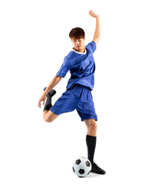 istock asian soccer player in action isolated white background 948486822