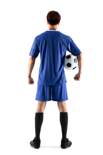 istock rear view soccer football player young man standing 948486916
