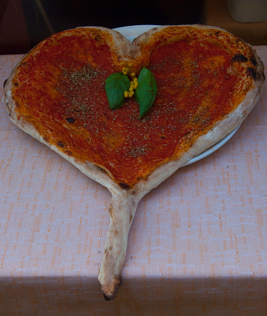 Pizza on a table outside Italian restaurant - Milan