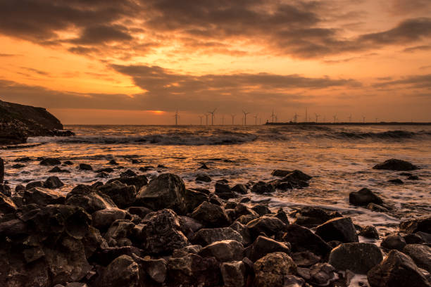 Turbines out to sea Wind turbines at sunrise off the North East coast hartlepool photos stock pictures, royalty-free photos & images