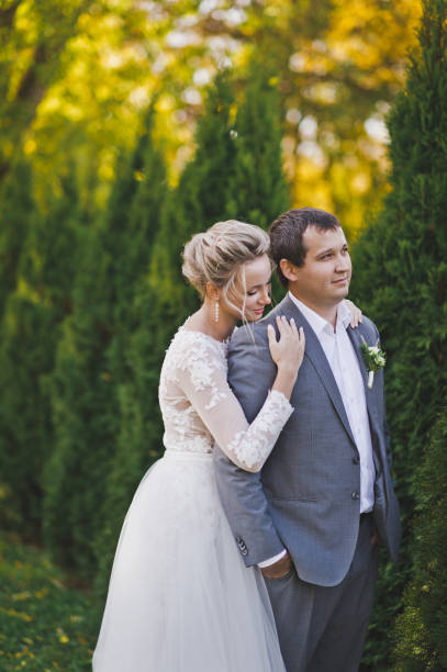 istock The couple stand about six-foot young trees 386. 948490866