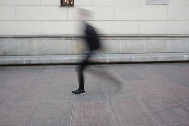 istock blurry person walks in town 948491408