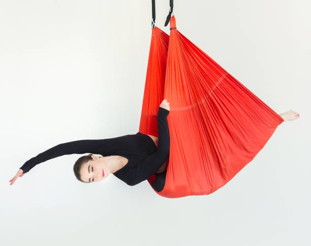 istock Woman practicing fly yoga over white background 948491922