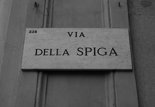 Municipal marble plaque engraved with the writing of della Spiga street in Milan - Italy