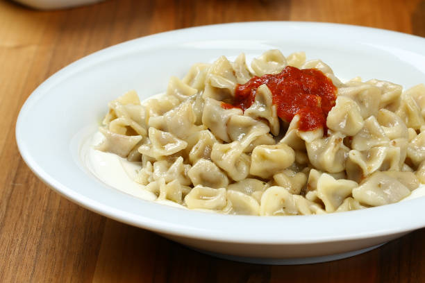 istock Turkish Manti with Yoghurt and Gravy Sauce - Ravioli 948495292