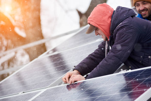 istock Men are engaged in the installation of solar cells 948498104
