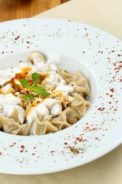 istock Turkish Manti with Yoghurt and Gravy Sauce - Ravioli 948499730