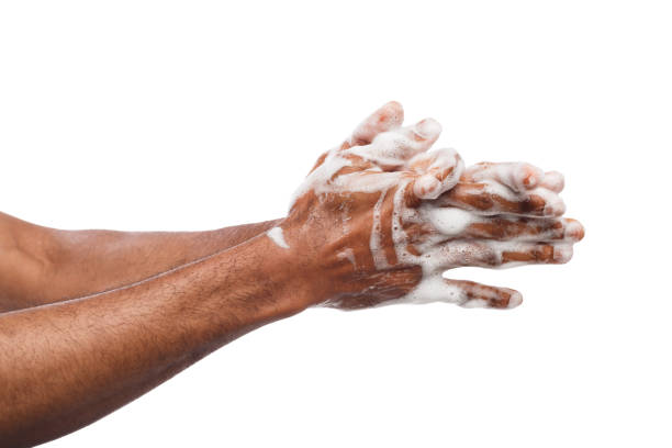 Black man washing hands isolated on white background