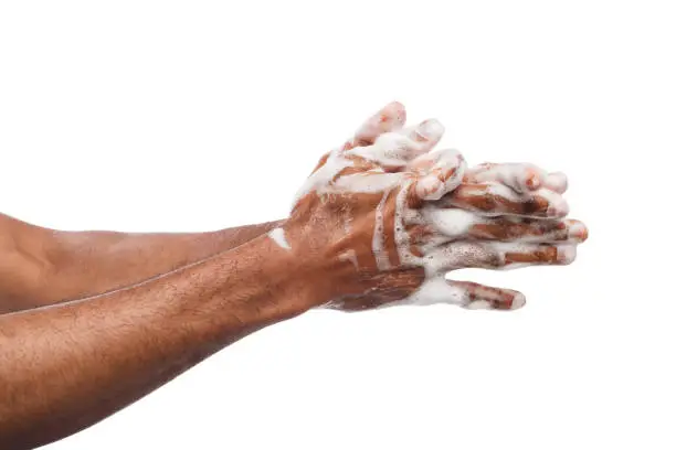 Photo of Black man washing hands isolated on white background