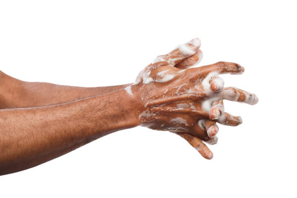 istock Black man washing hands isolated on white background 948502334