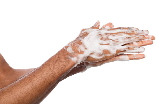 istock Black man washing hands isolated on white background 948502350