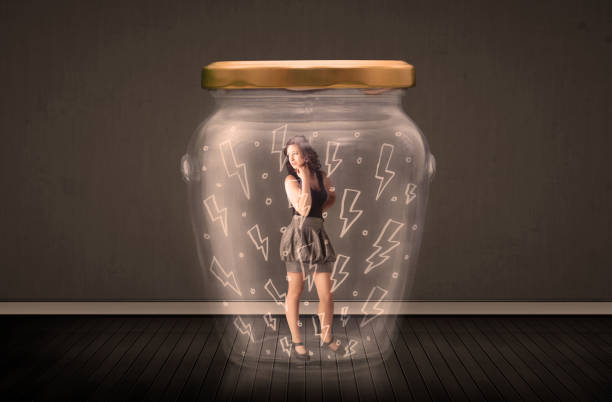 istock Businesswoman inside a glass jar with lightning drawings concept 948503292