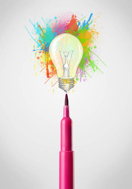 istock Felt pen close-up with colored paint splashes and lightbulb 948503556