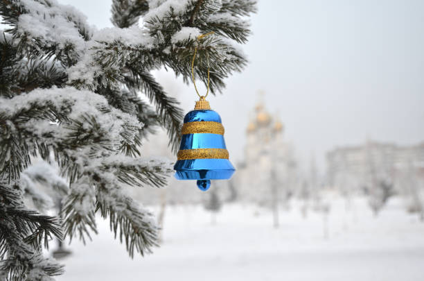 New Year's tree with decorations, on the background of the church