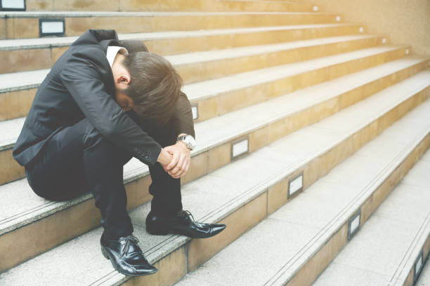 istock Businessman loses shares. 948507376