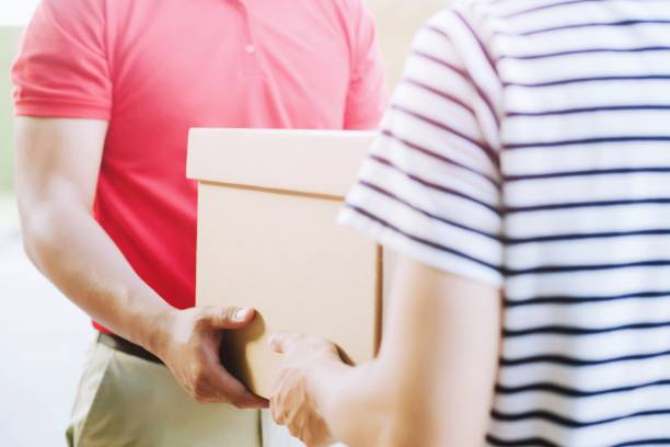 istock Postal hand delivery man and Professional delivery service.Impressive service. 948507584