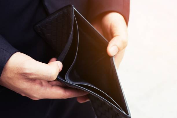 istock Empty wallet (no money) in the hands of an man. Cost control expenses poverty in concept 948508142