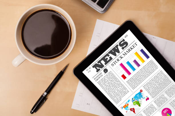istock Tablet pc shows news on screen with a cup of coffee on a desk 948508252