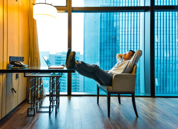 istock Businessman relaxing at his desk 948510624