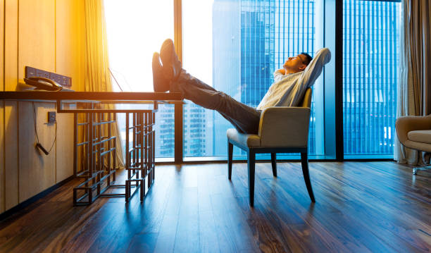 istock Businessman relaxing at his desk 948510632
