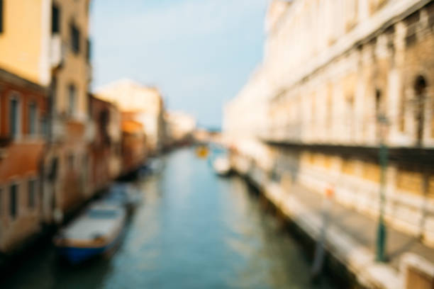 Blurred Venice background. Venetian canal with boats.
