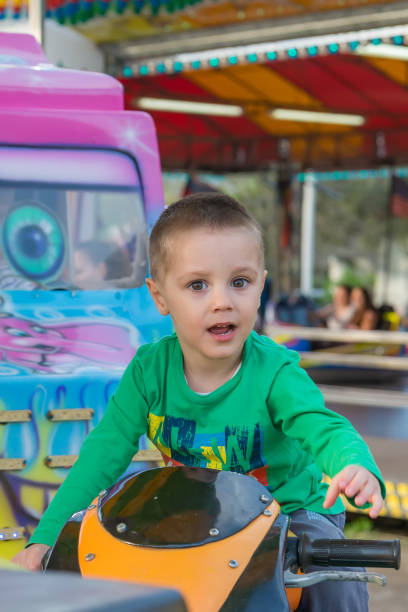 istock little boy in amusement park 948511084