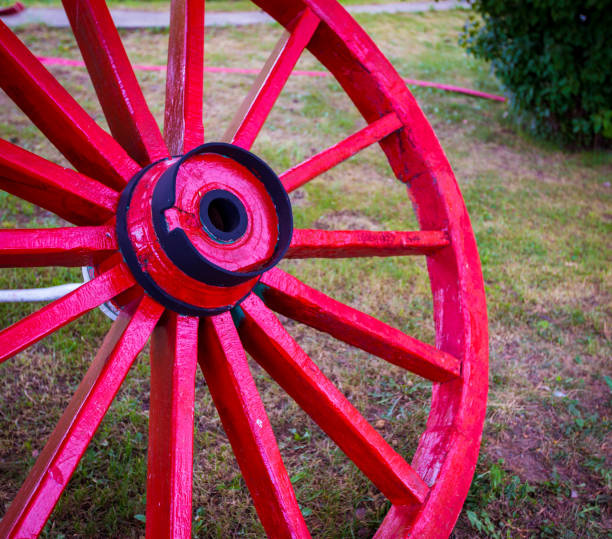 istock wooden red wagon wheel 948512230