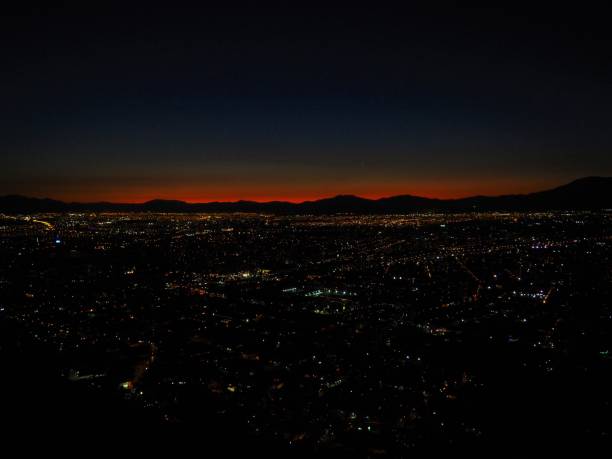 istock Night view on city with moon and colored sky 948515076