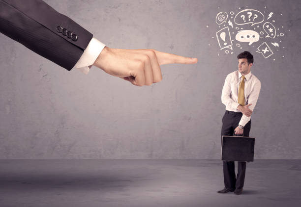 istock Boss hand pointing at confused employee 948519076