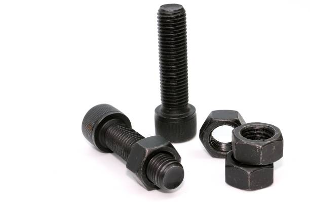 istock Black steel bolts and nuts mechanical part 948520348