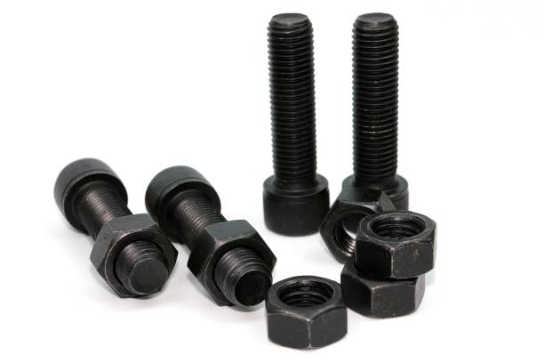 istock Black steel bolts and nuts mechanical part 948520394