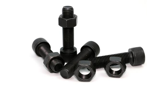 istock Black steel bolts and nuts mechanical part 948520458