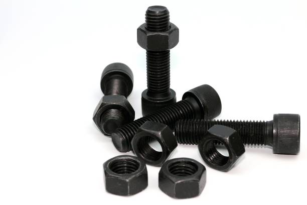 istock Black steel bolts and nuts mechanical part 948520540