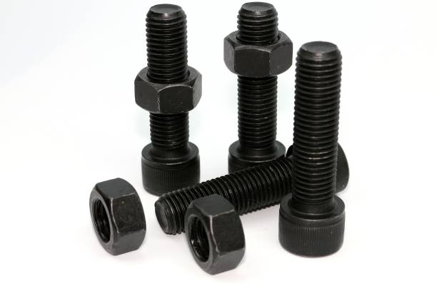 istock Black steel bolts and nuts mechanical part 948520654