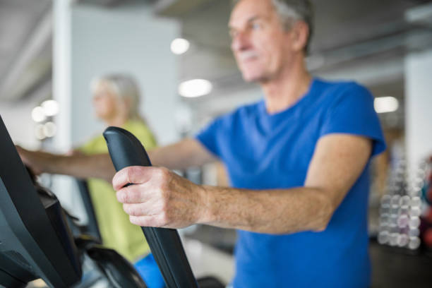 istock Senior man holding hand on stair stepper holder 948520758