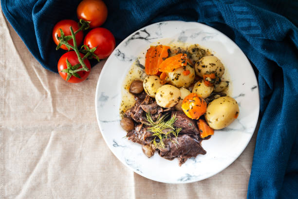 istock Beef stewed and Carrots potatoes with a wine sauce and herbs 948527296