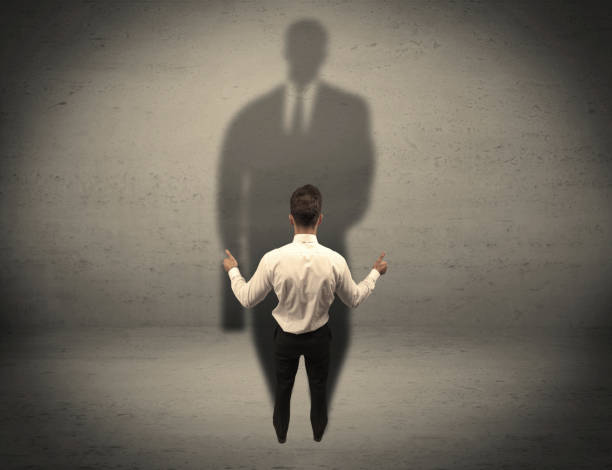 istock Businessman looking at big shadow concept 948531878