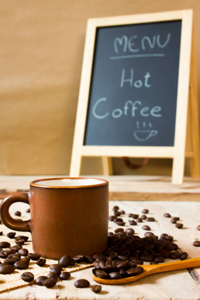 istock coffee beans and cup on the wooden table 948532224