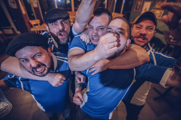 istock Men in sports bar 948536354