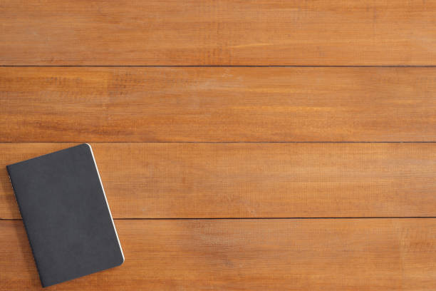istock Minimal work space - Creative flat lay photo of workspace desk. Office desk wooden table background with mock up notebooks. Top view with copy space, flat lay photography. 948539148