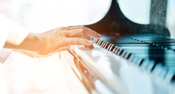 istock Woman hands playing piano 948539152