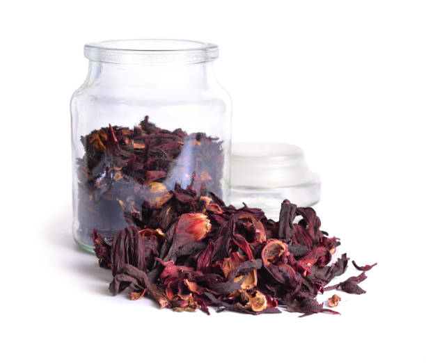istock Dry hibiscus tea in glass jar. Isolated on white background. 948539418