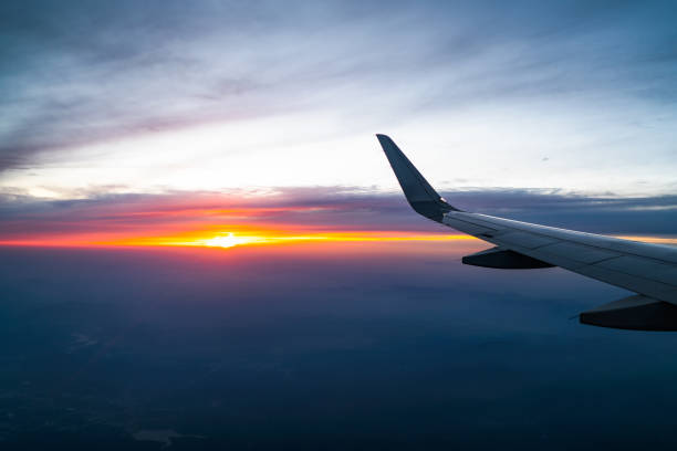 istock Plane travel, beautiful sunset, world travel 948544160