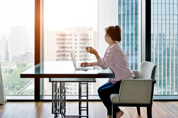 istock Woman enjoying coffee and looking out 948544414