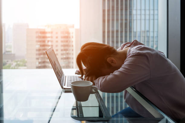 istock Tired woman sleeping on desk 948544592