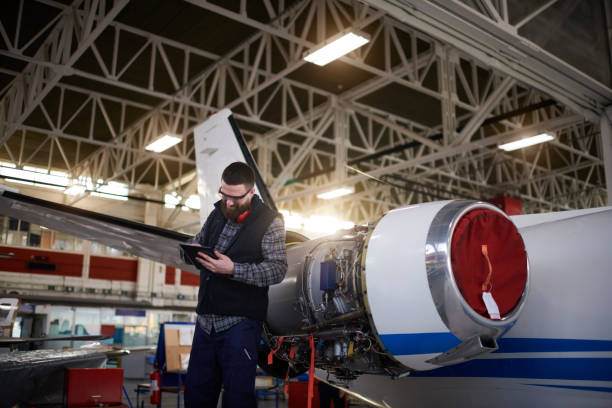istock Aircraft mechanic in the hangar 948556384