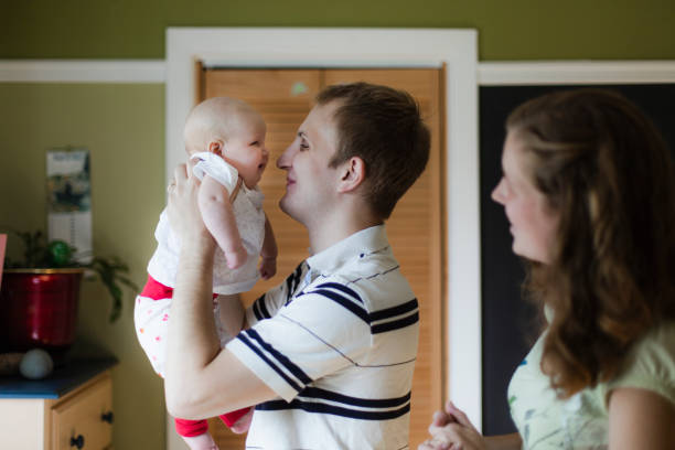istock Parents holding their cute baby daughter 948559776
